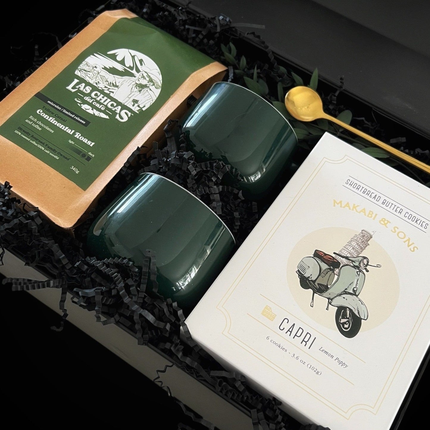 Cup of Cheer holiday gift box featuring two porcelain mugs, artisan cookies, premium coffee, and a gold spoon, elegantly styled with festive touches