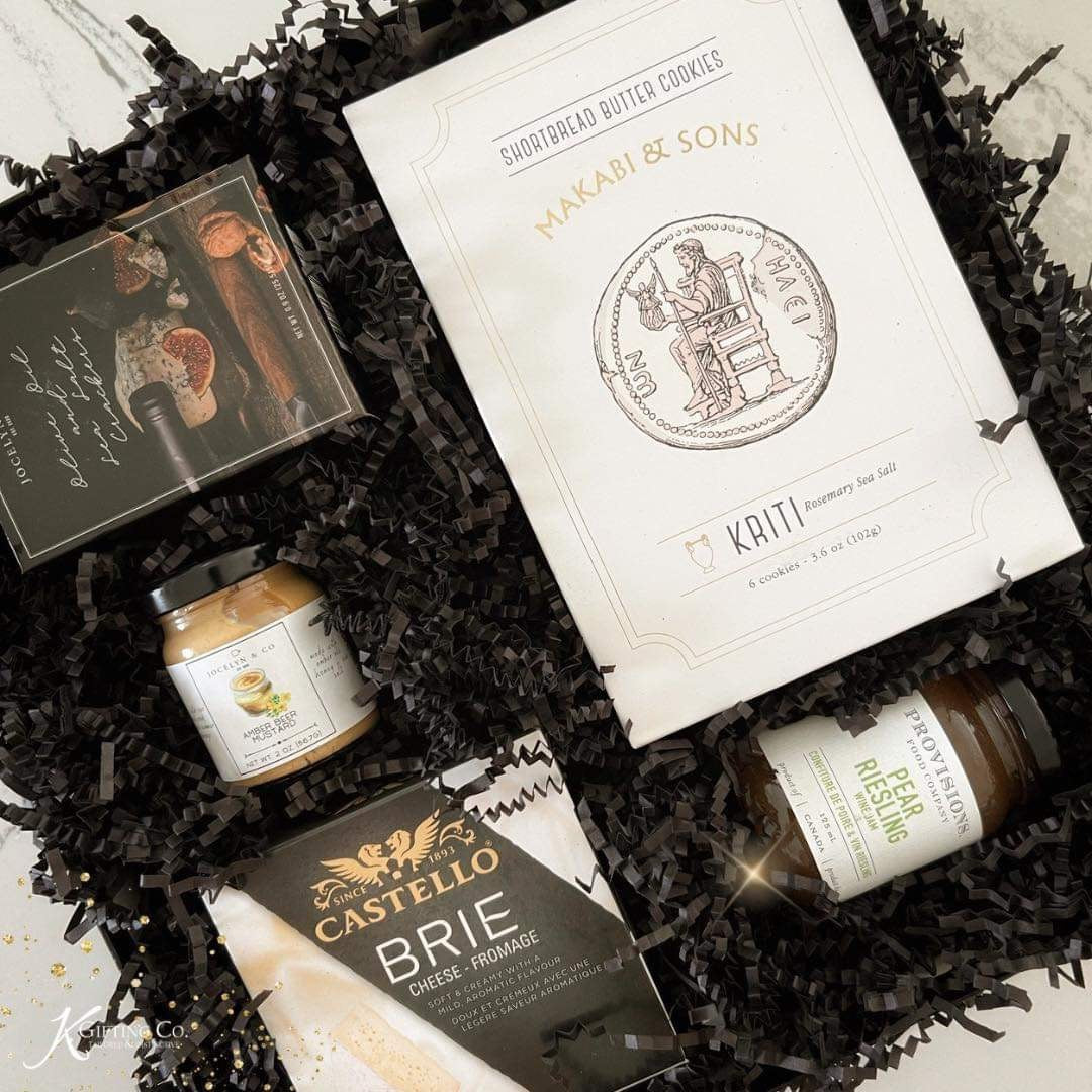 A luxurious cheese and cracker gift box with artisan jam, mustard, shortbread, and creamy brie. Perfect for foodies, hosts, or client gifts.