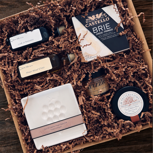 The Tasting Table luxury gourmet closing gift with olive oil, balsamic vinegar, brie, honey, preserve and dipping dish.