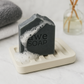 Elevate your grooming with this luxurious body bar, infused with nourishing oils, detoxifying charcoal, and kaolin clay.